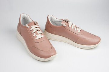 Light brown faux leather shoes with laces. Close-up shot.