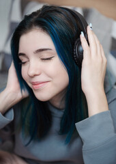 Fototapeta premium Happy teenager listening to music