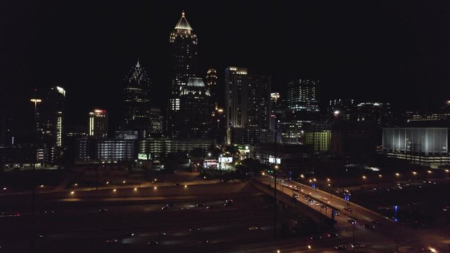 Atlanta Georgia At Night Slow Rising Aerial of Downtown Traffic and Buildings