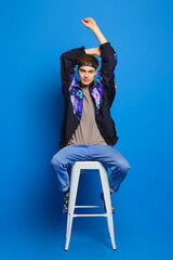 Male casual outfit - windbreaker jacket, olive shirt, jeans and socks with print © boomeart