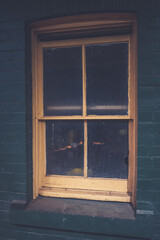 Wooden window in brick wall