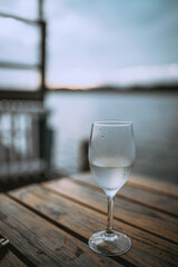 Glass of wine by the water