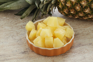 Marinated pineapple slices in the bowl