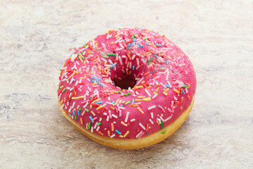 Sweet glazed struwberry donut with icing