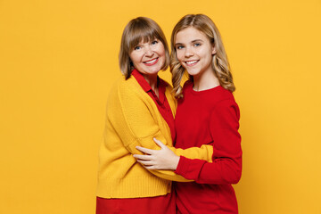 Happy cheerful happy woman 50s in red shirt have fun with teenager girl 12-13 years old....