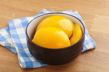 Sweet canned peaches with syrope