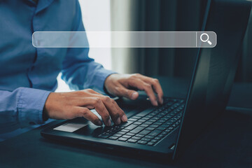 Businessman hands working with laptop computer, Searching browsing internet data information with blank search bar.