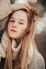 girl having fun in the winter forest