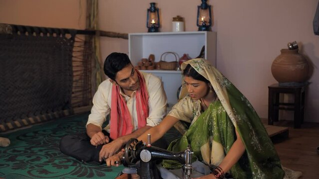 A pretty rural housewife making clothes on her old sewing machine in her free time. A progressive farmer offering his hard-earned money to his cheerful wife - farm sales  agribusiness  income  profit