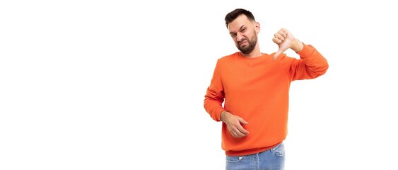 upset annoyed man with a sullen face and negative emotions shows a dislike on a white background