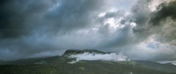 Beautiful Western Ghats mountain landscape with passing clouds. Munnar, India