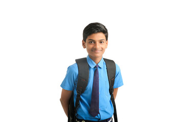 Indian school boy standing on white background.