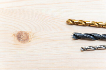 Drill bits. Screwdriver and bits. Replacing a bit on a screwdriver. Texture tree background.
