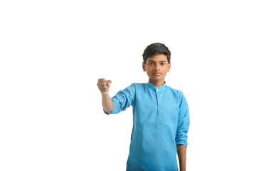 Indian boy in traditional wear and giving hand expression on white background.