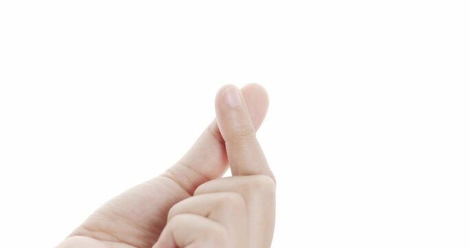 Make a mini heart shape with your index finger and thumb. Symbol that represents a moment of love and take care on white background.