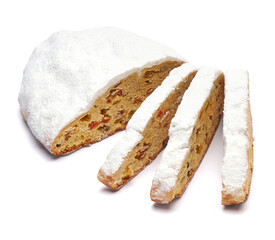 Sliced Traditional Christmas stollen cake with marzipan and dried fruit isolated on white background