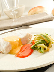 Merluza con mahonesa y verduras. Hake with mayonnaise and vegetables.
