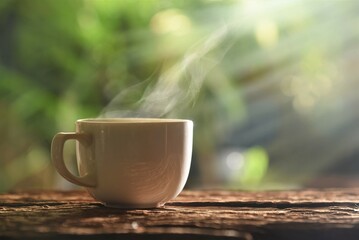 cup of coffee on table in garden