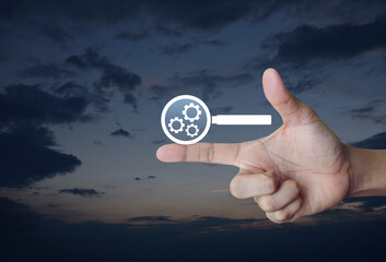 seo flat icon on finger over sunset sky, Technology search engine optimization concept