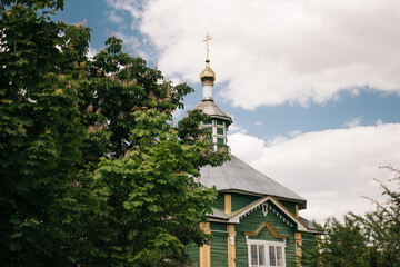 Fototapeta na wymiar An old wooden church in the village of Morino, Grodno region, Belarus.