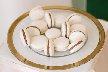 Beautiful candy bar decor with homemade macaroons with chocolate