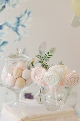 Fototapeta na wymiar Beautiful candy bar decor with homemade craft marshmallows and cupcakes