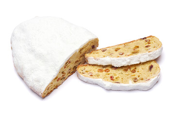 Sliced Traditional Christmas stollen cake with marzipan and dried fruit isolated on white background