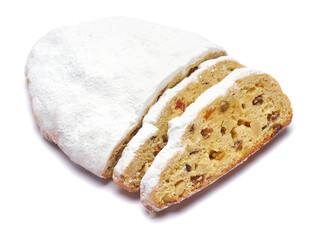 Sliced Traditional Christmas stollen cake with marzipan and dried fruit isolated on white background