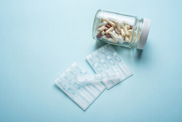 Eye drops and pills medical background