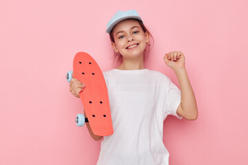 little girl cap in white t-shirt skateboard childhood unaltered