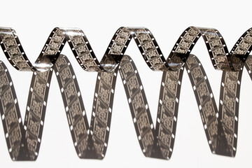 narrow, 16mm film on white background	