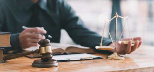 Judge gavel with Justice lawyers, Businessman in suit or lawyer working on a documents. Legal law, advice and justice concept.