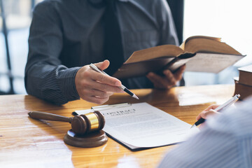 Business people negotiating a contract. Human hands working with documents at desk and signing...