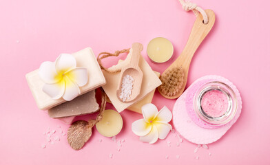 Care Products Soap Sea Salt Brush Face Face Sponge Body Oil After a Bath on Pink Background The Concept of Home Spa Top View