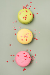 French Macaroon or Macaroons on Green Background Tasty Modern French Dessert Vertical