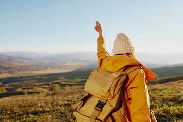 woman tourist admiring the landscape mountains nature sunny day
