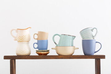kitchen utensils on  wooden shelf on  white background