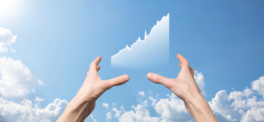 Business man holding tablet and showing holographic graphs and stock market statistics gain profits. Concept of growth planning and business strategy. Display of good economy form digital screen.