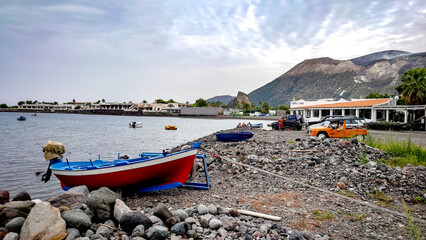 fishing boats on the shore of a sea, Vulcano Island a small volcanic island belonging to Italy in the Tyrrhenian Sea,  Aeolian Islands
