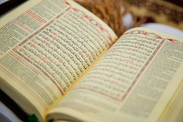Naklejka na ściany i meble muslim small holy quran with indonesian translate extreme close up