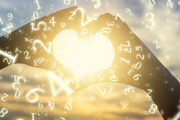numerology, a young girl folded her hands in the shape of a heart against the background of the sun...