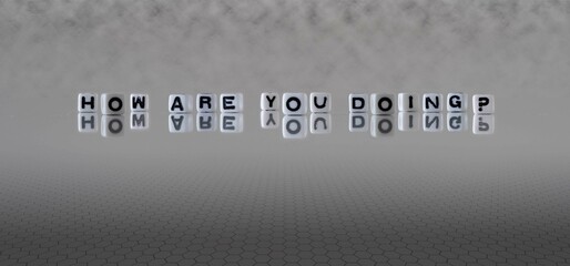 how are you doing? word or concept represented by black and white letter cubes on a grey horizon...