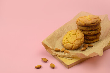 homemade cookies with almond, almond cookies on a pink background, delicious and healthy dessert
