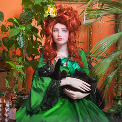 Portrait of a girl with a beautiful hairstyle in the Rococo style in a green dress against plants'...