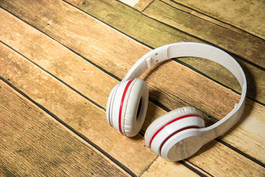 Wireless Headphones Red White On Wooden Floor