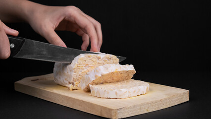 Slicing Tempeh on a Cutting Board