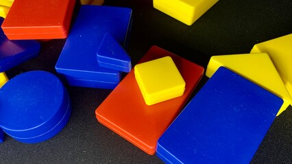 Developing colorful games for intelligence for young children. Shapes, signs, letters for memorization through the game