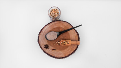 All Kinds of White Pepper on a Wooden Coaster