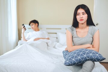unhappy young asian couple have problems in relationships.