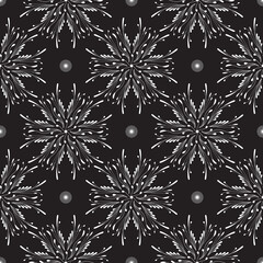 Seamless pattern with white abstract flowers on a black background for packaging, fabrics, backgrounds and other products.